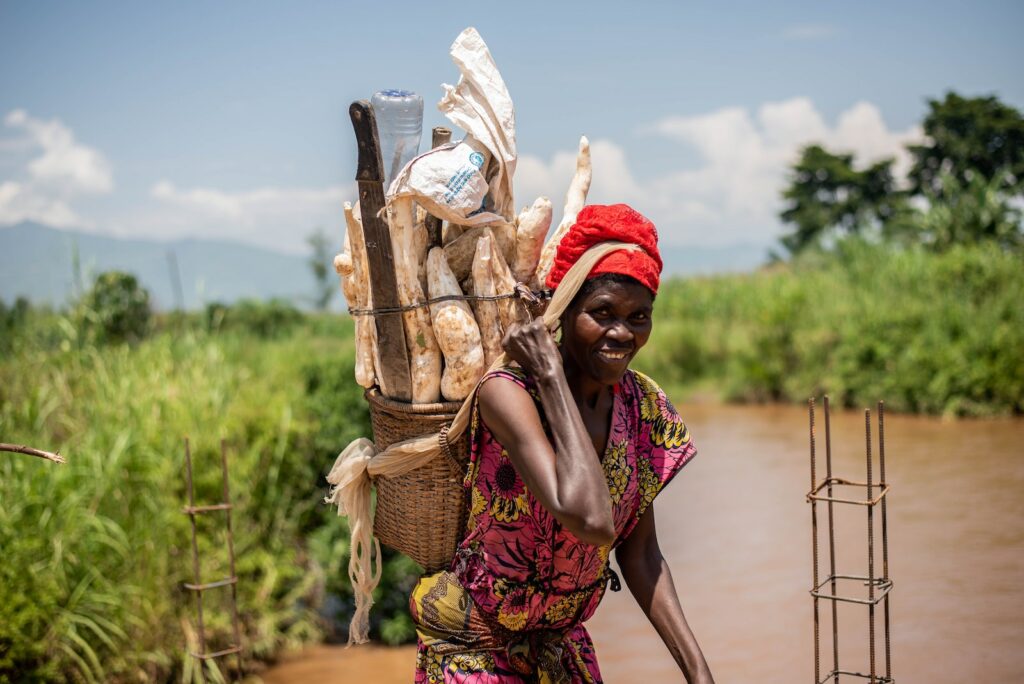 Smiling Woman Carrying Basket on Back